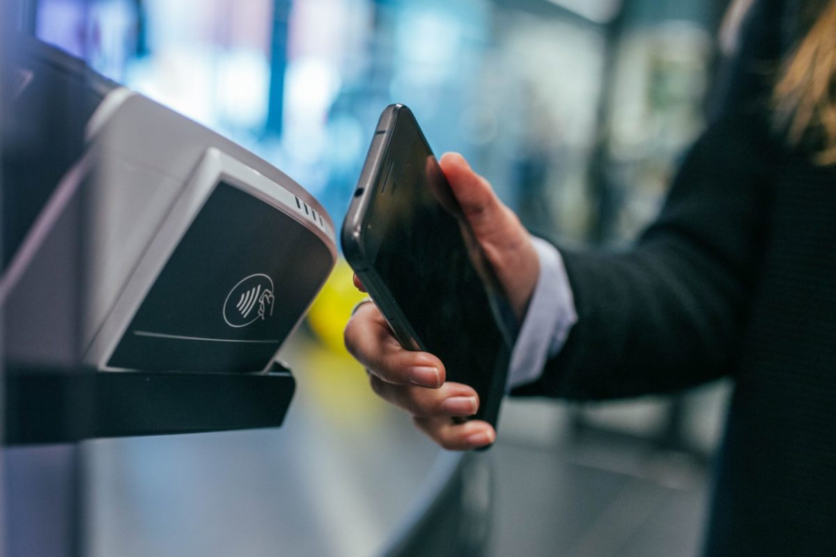 Person using a phone on a scanning device